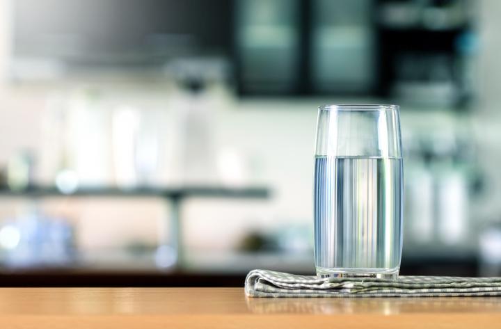 A glass of water on a benchtop