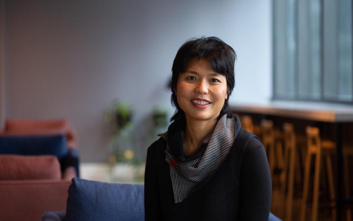 Maureen, an Essential Services Commission employee sitting and smiling in an office