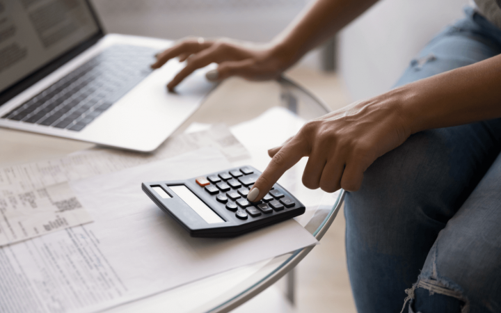 Photo of a woman looking at bills