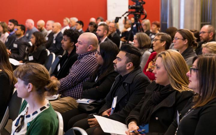 An image of a crowd of seated people all listening to a speaker (offscreen) at a family violence conference on 30 August 2018.